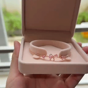 Blush Ribbon Bow Bracelet in motion