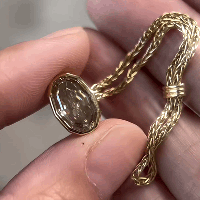 Flexible woven-chain ring with a bezel-set center