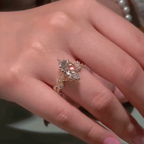 Marquise ring with ornate vine-inspired shoulders